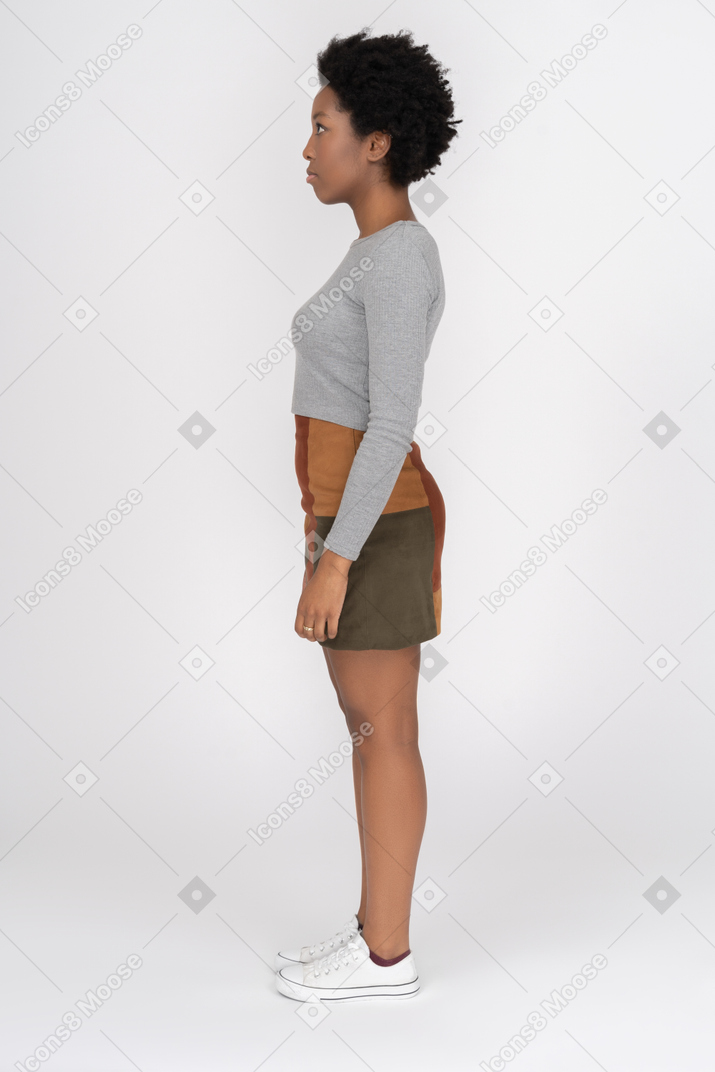African girl standing in profile