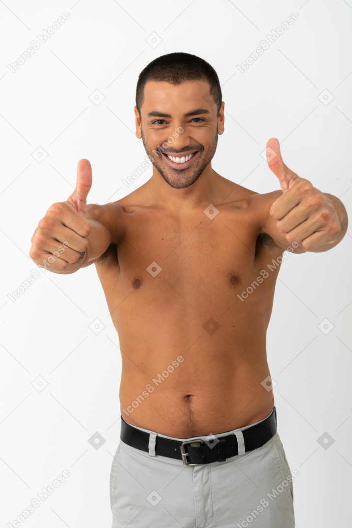 Contented barechested male showing thumbs up