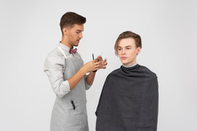 A young barber and his client