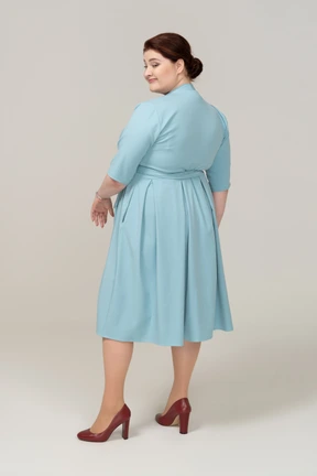 Rear view of a woman in blue dress