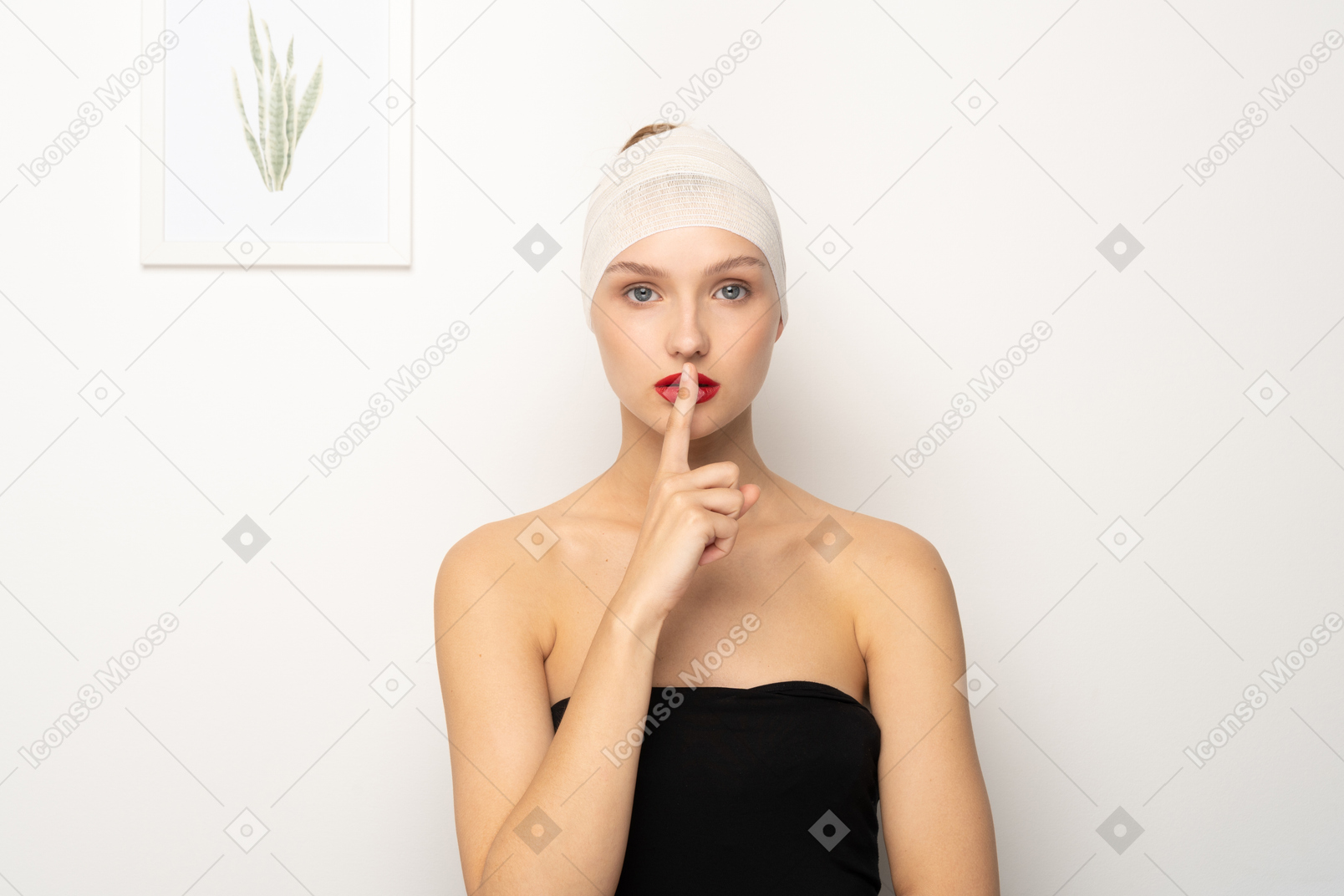 Young woman making shush gesture