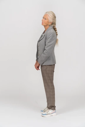 Old lady in suit standing in profile