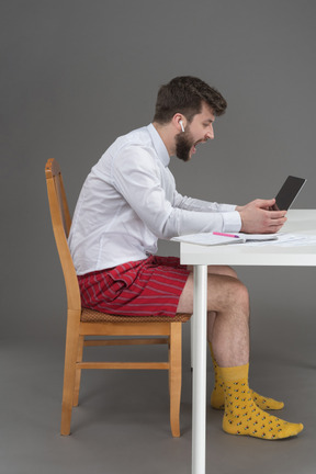 Depressed freelancer shouting at his laptop