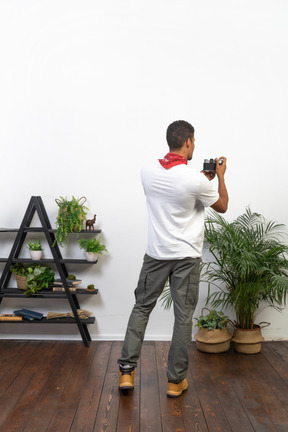 Good looking young man with a camera