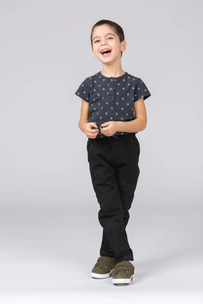 Front view of a cute boy laughing and looking up