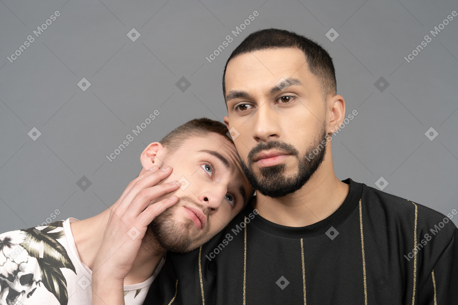 Young man putting his head on boyfriend's shoulder