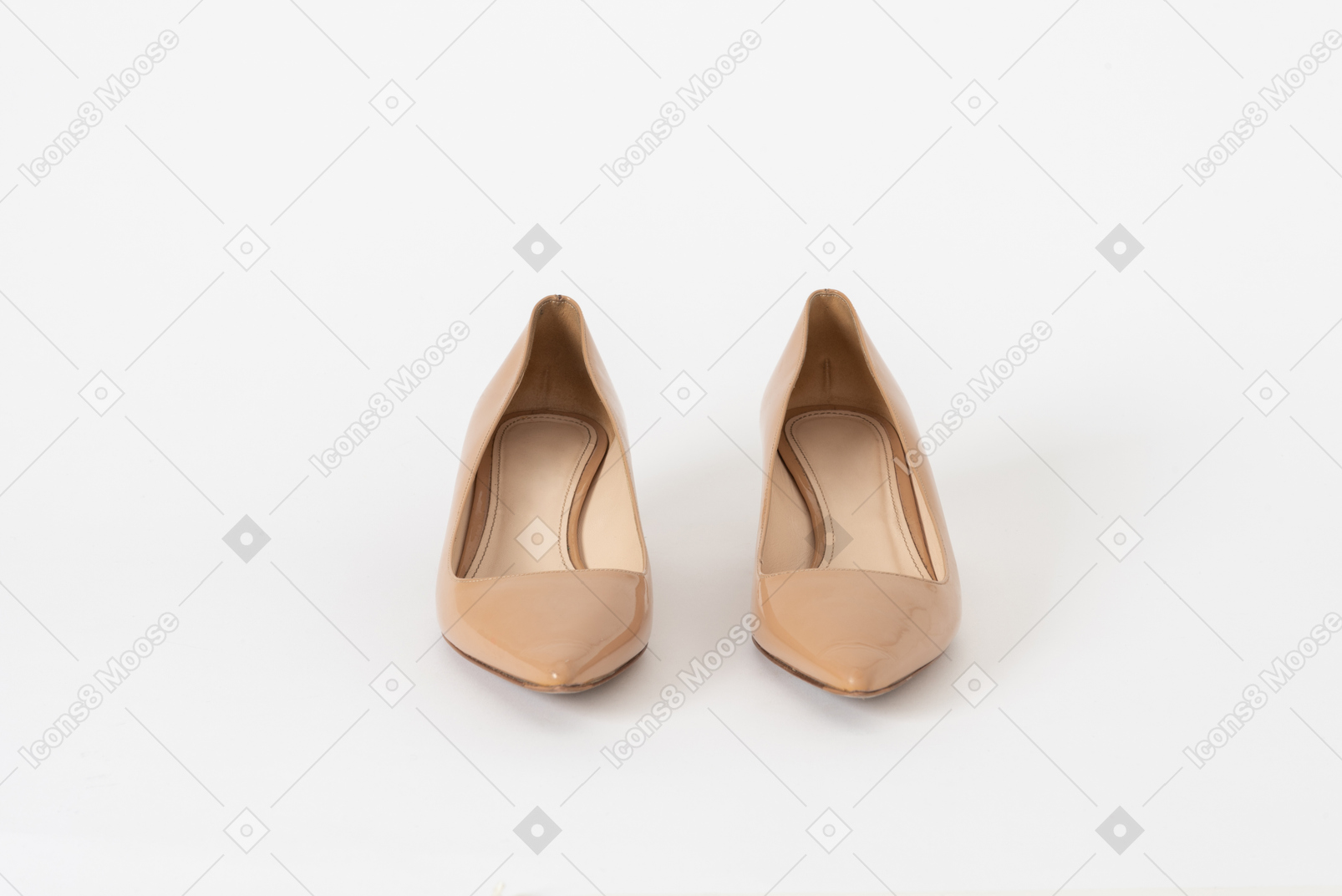 A front shot of a pair of beige lacquer court shoes