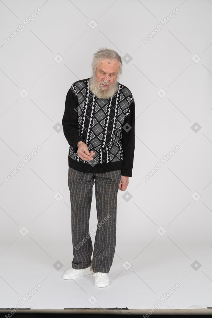 Front view of an elderly man raising his hand