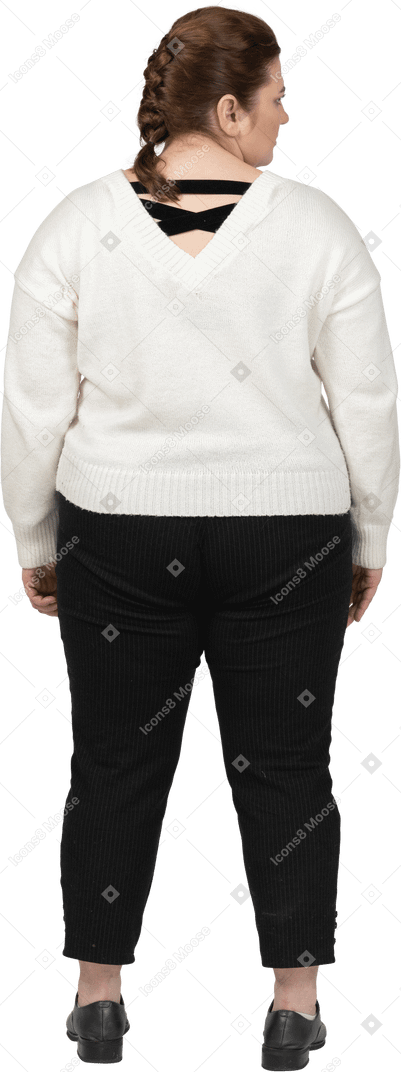 Plump woman in casual clothes standing