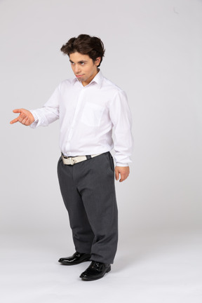 Man in office clothes pointing at something