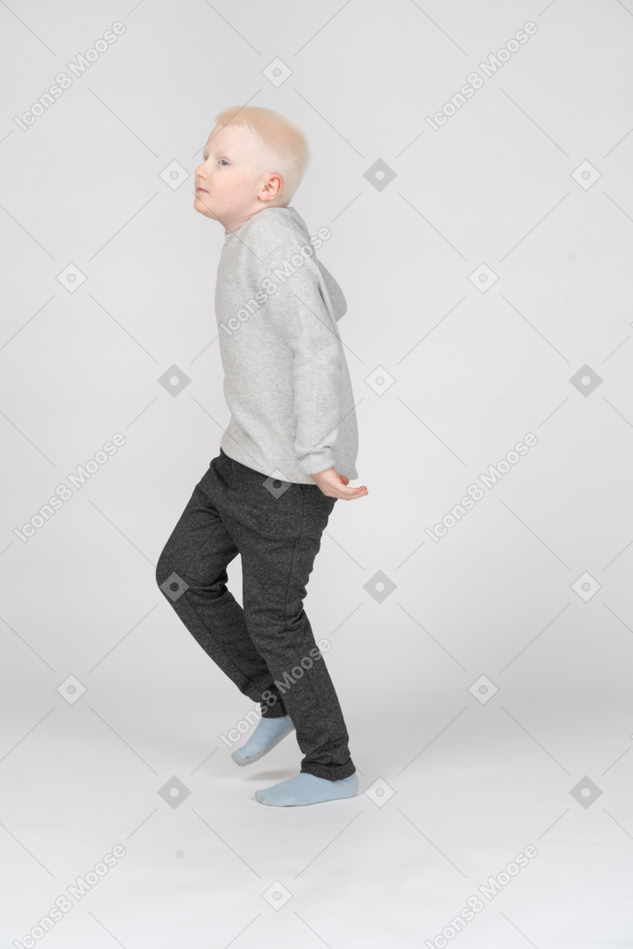 Side view of a boy running