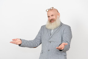 Laughing mature professor with eyeglasses on head