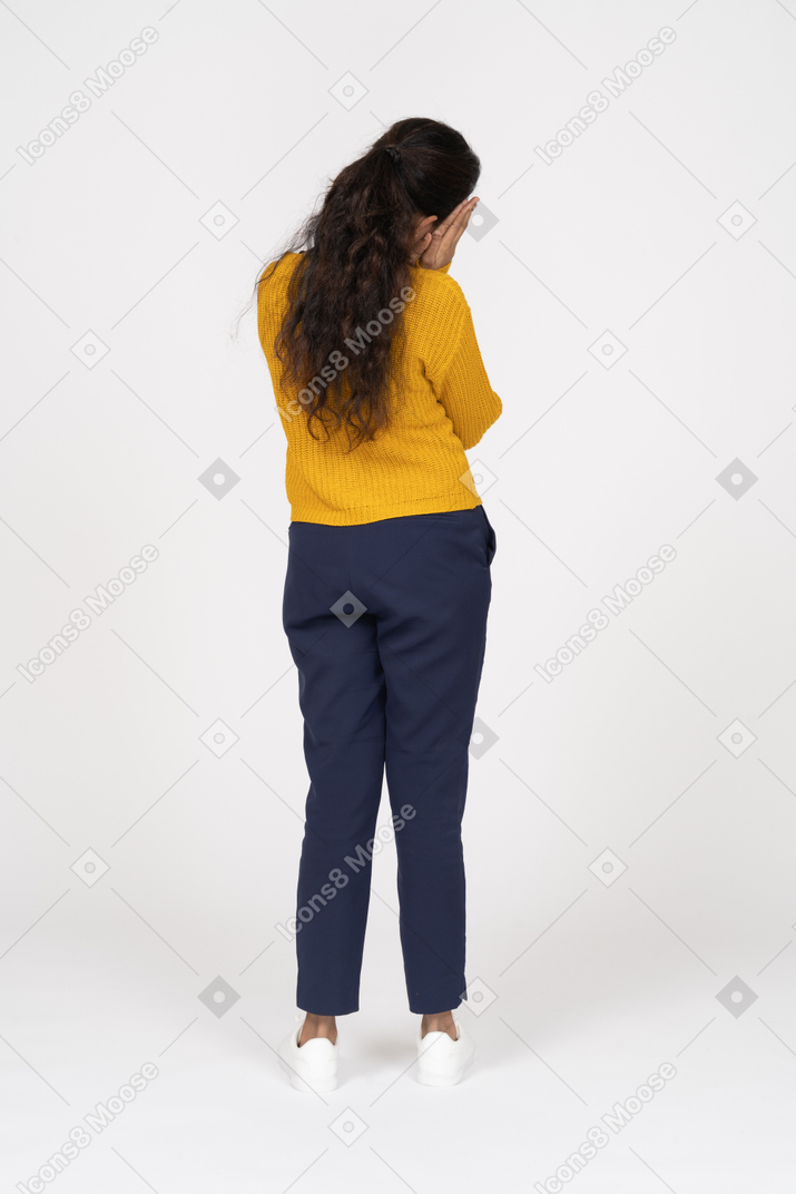 Rear view of a sleepy girl in casual clothes