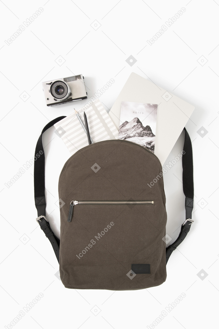 City backpack with laptop and photo camera