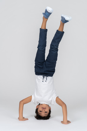 A boy standing on his head