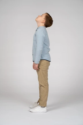 Side view of a cute boy looking up