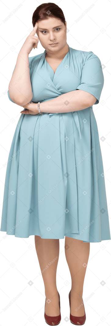 Front view of a woman in blue dress thinking