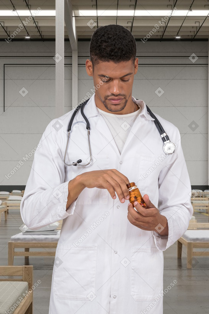 Doctor holding a bottle of pills