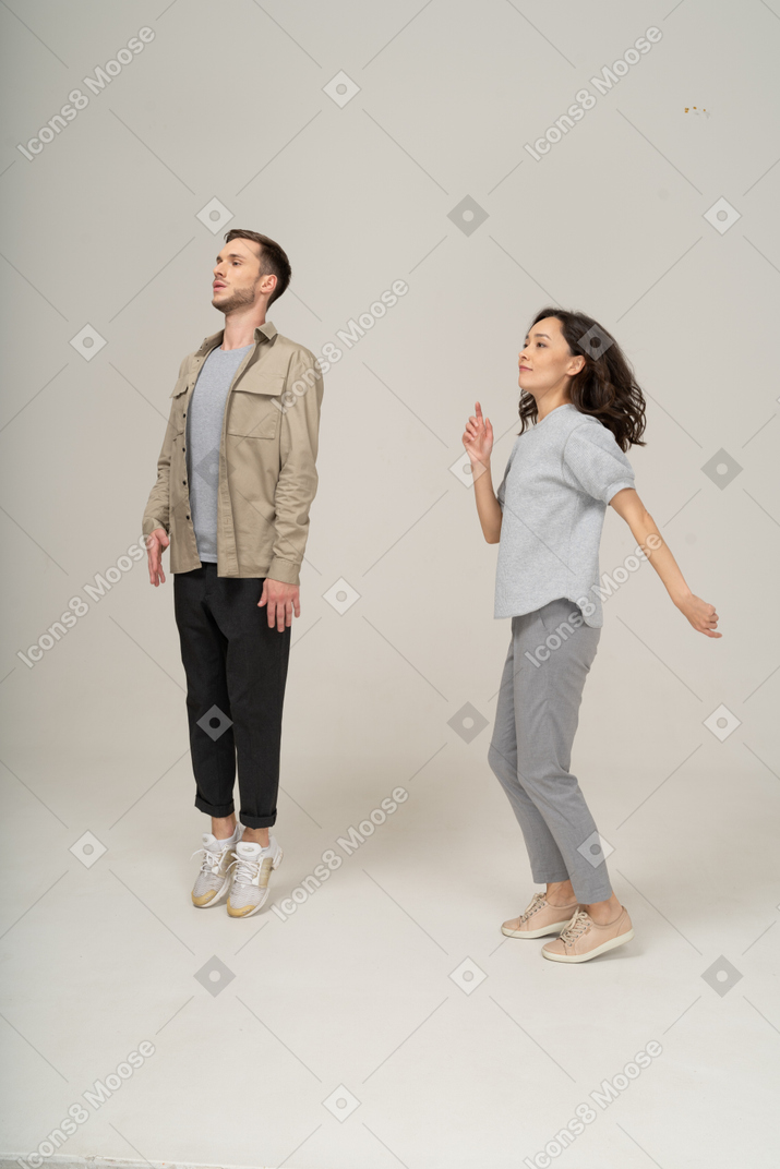 Active young man and woman in motion
