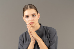 Front view of a young woman in a jumpsuit with clean skin