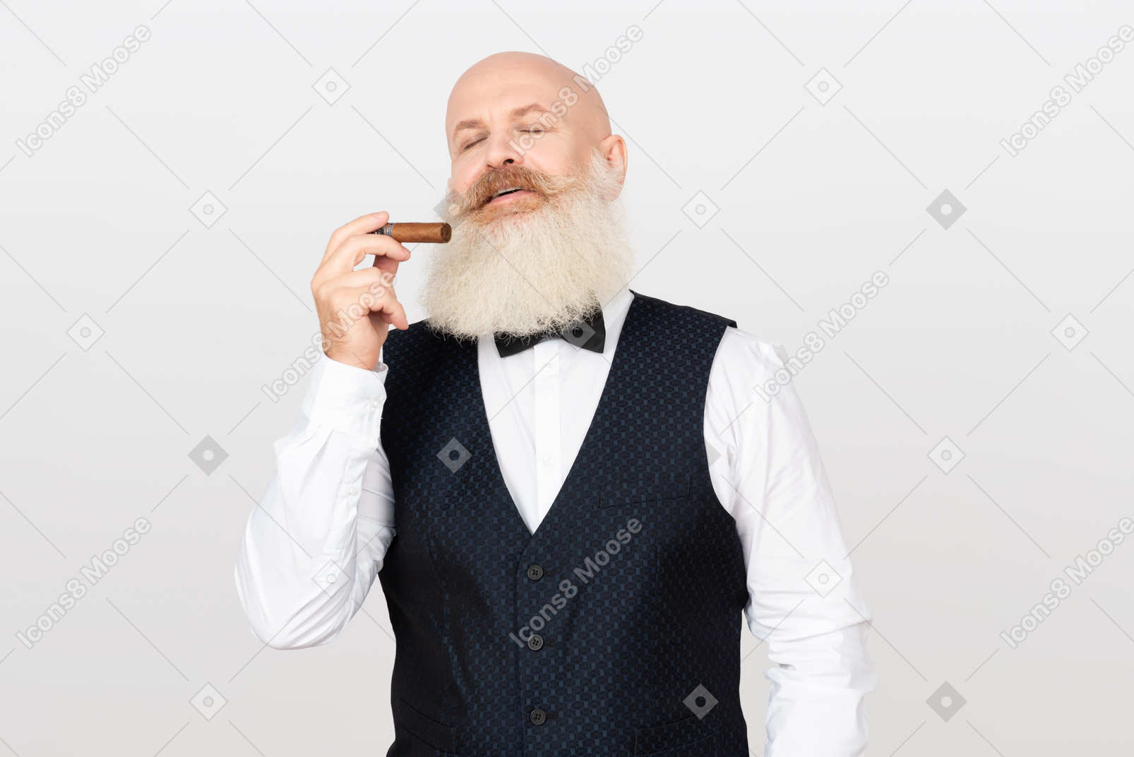 Mature bearded man smelling a cigar
