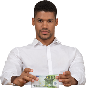 Young man holding money