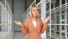 A woman standing in front of a row of scaffolding