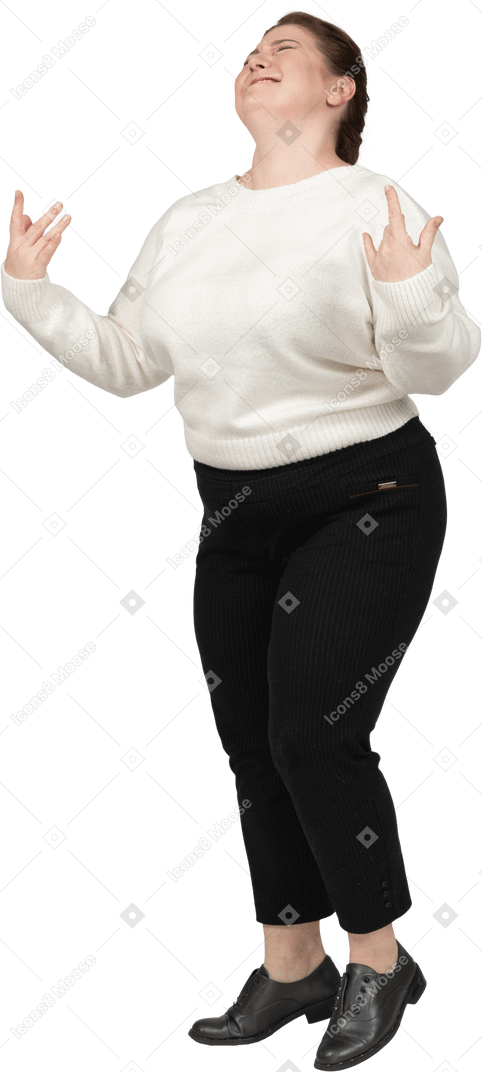 Plump woman in white sweater dancing