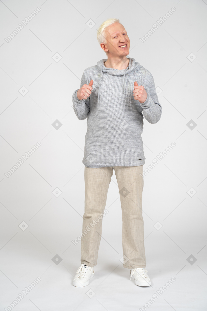 Man showing thumbs up and looking at camera