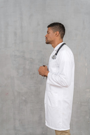 Side view of a solemn-looking doctor