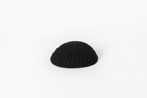 Black kippah on white background