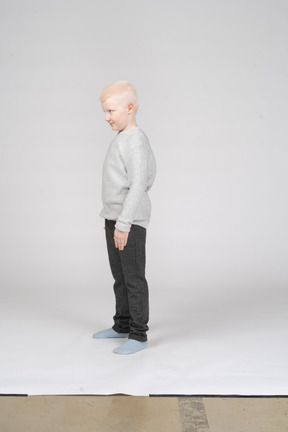 Side view of a boy standing