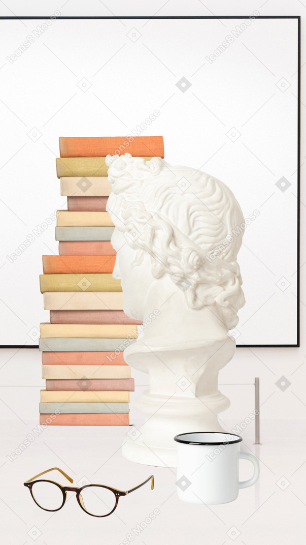 Stack of books, pair of glasses, white bust and mug