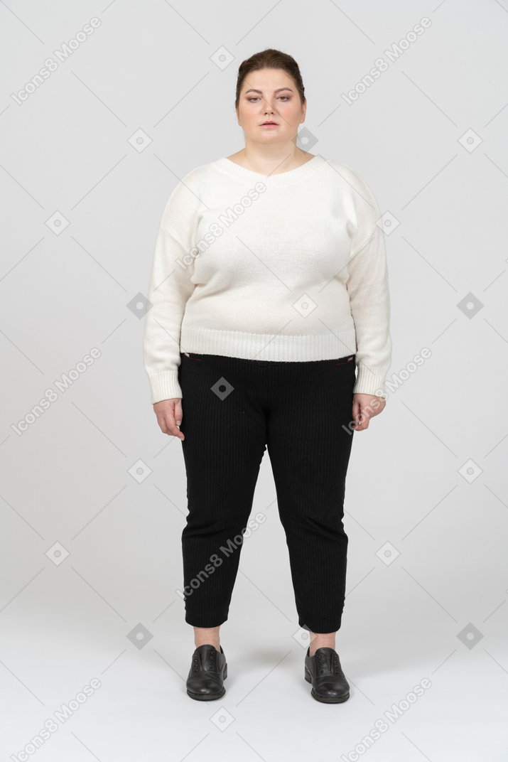 Plump woman in casual clothes standing