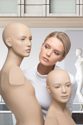Young woman with mannequins