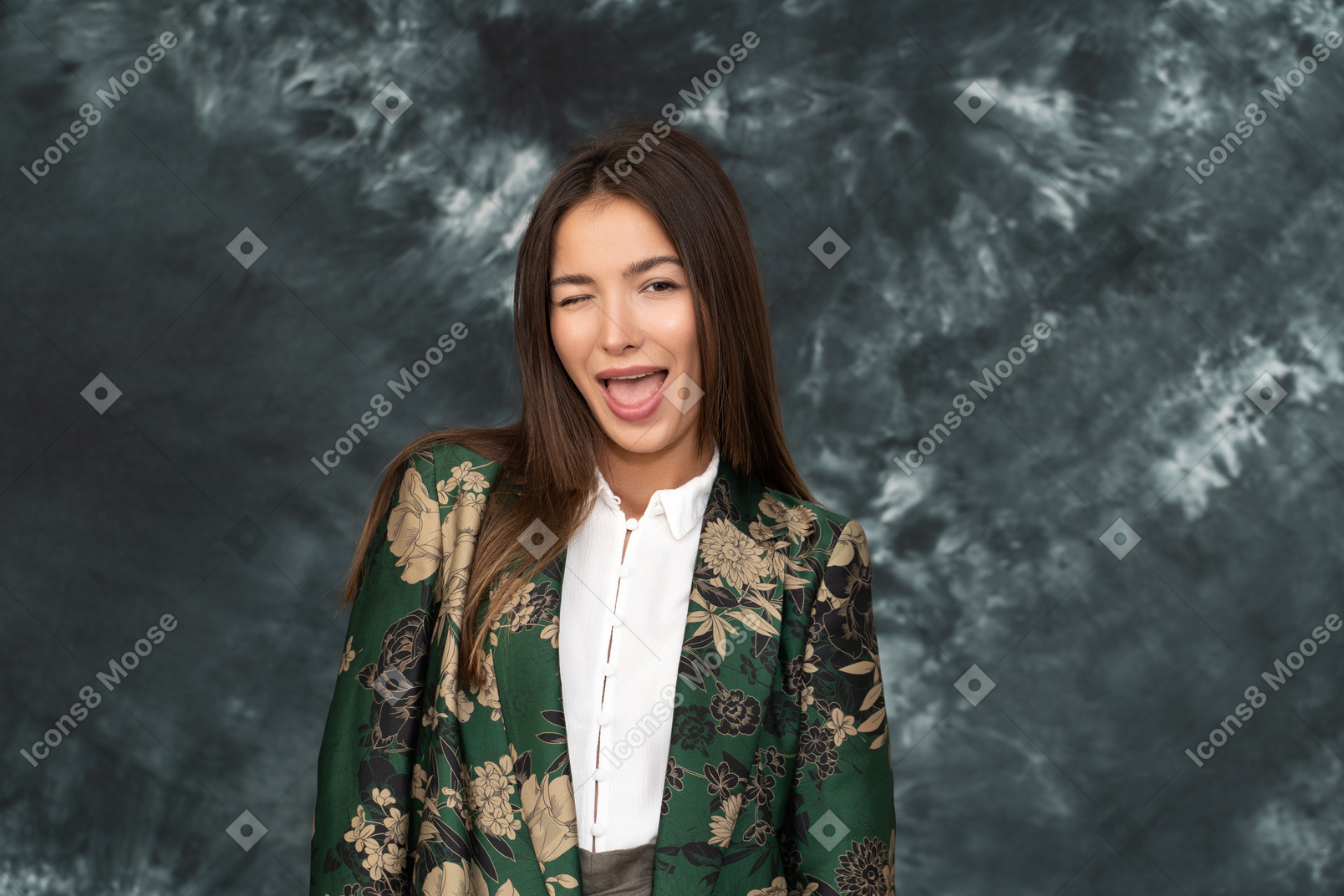 Portrait of winking business woman in green japanese jacket