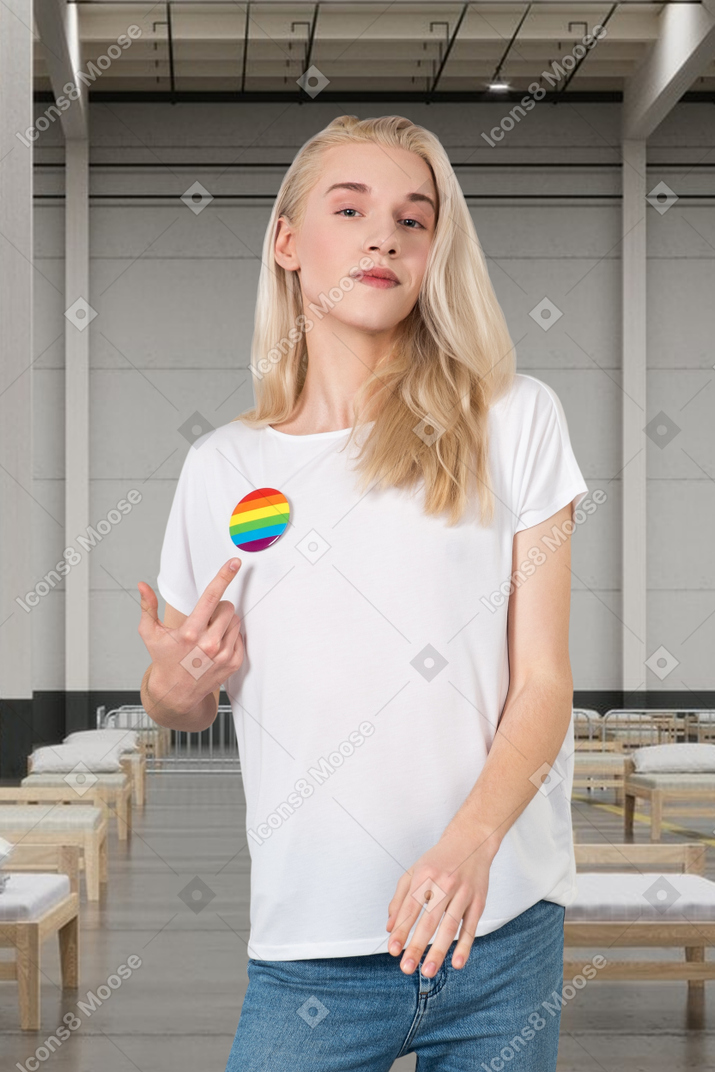 Woman pointing at lgbt badge on her t-shirt