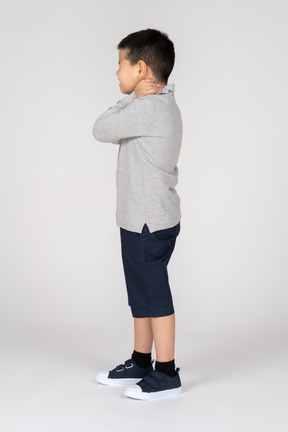 Boy holding neck