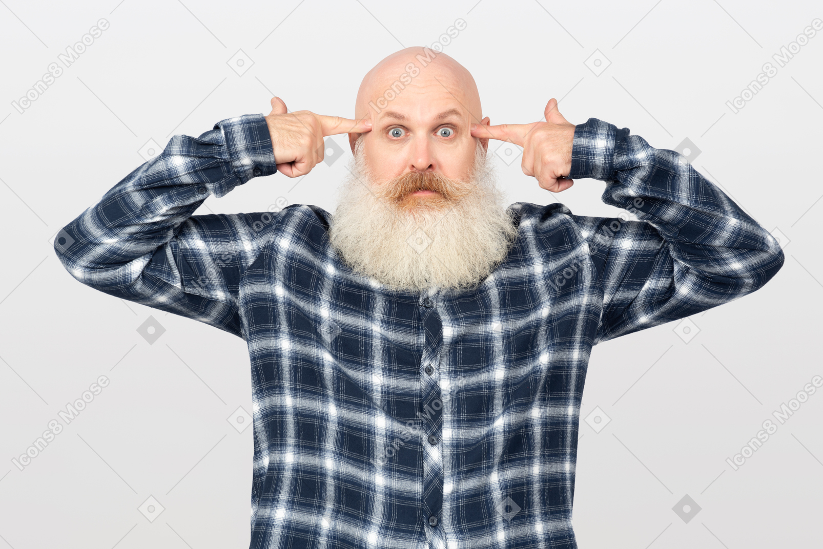 Bearded man holding pointing fingers at his temples