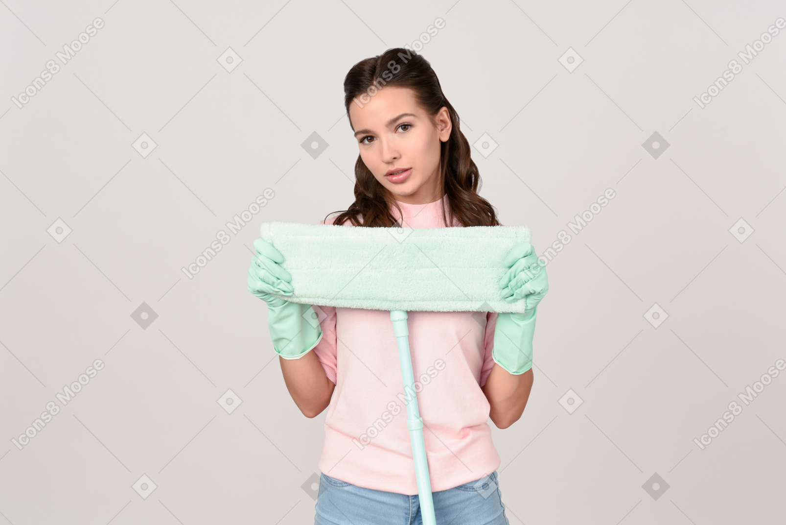 Attractive young woman holding a mop pad