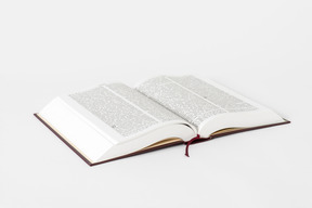 Open bible book on white background