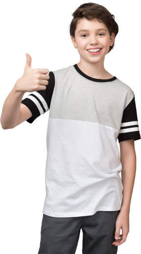 Smiling boy showing thumbs up
