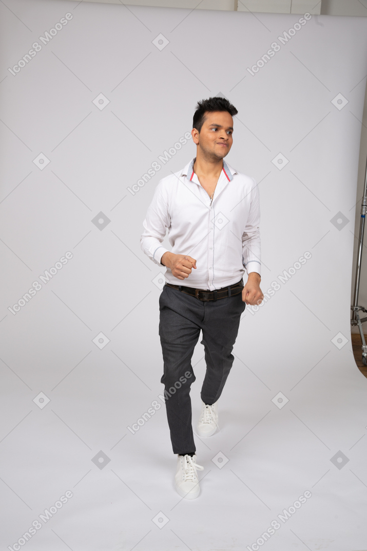 Man in white shirt walking