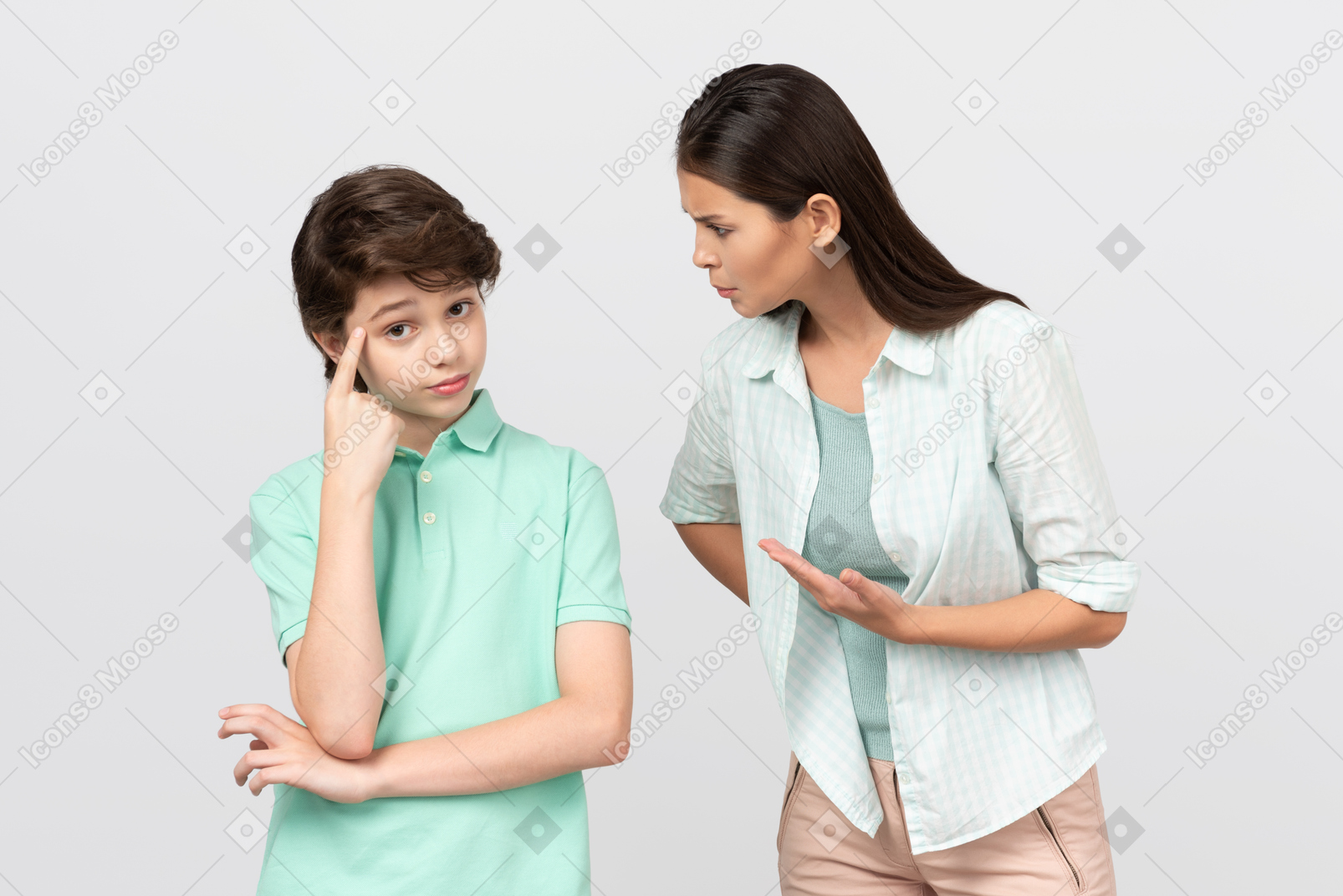 Angry mother telling her son off