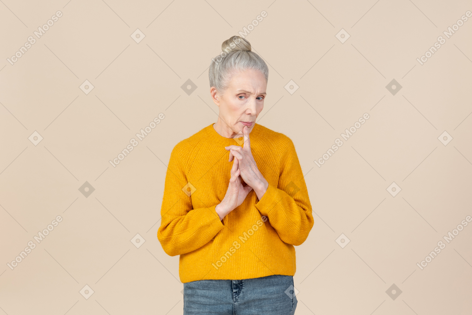 Elegant older woman in a mustard sweater