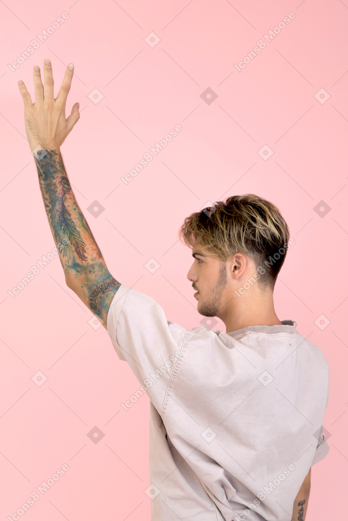 Young man waving hand