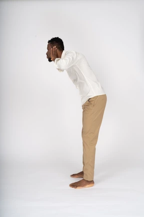 Man in white shirt standing