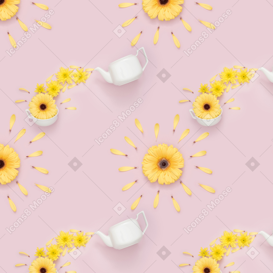 Teapot, cup and yellow flowers over pink background