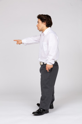 Man in white shirt pointing