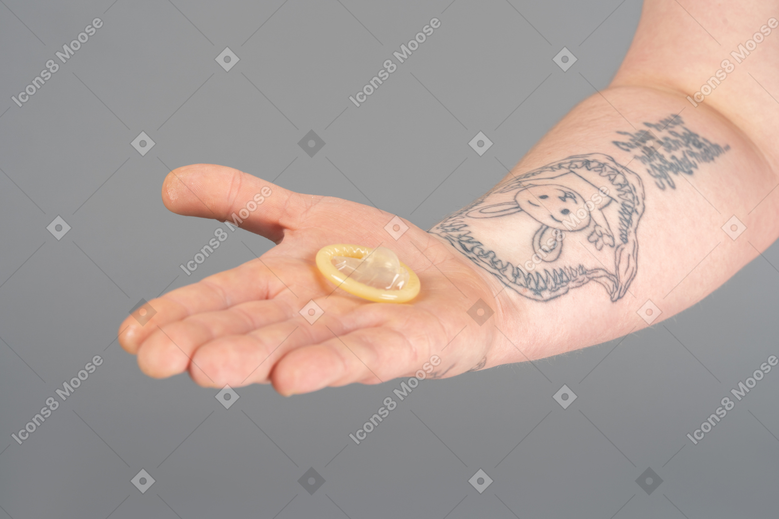 Holding a condom